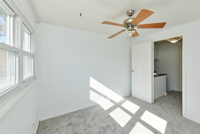 1613 Hartmann Dr, Schaumburg, IL 60193 - unfurnished bedroom with carpet, baseboards, and a ceiling fan