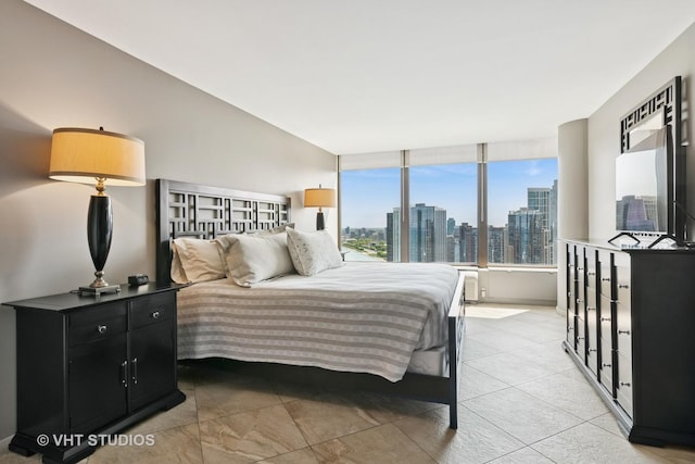 505 N Lake Shore Dr Unit 4807, Chicago, IL 60611 - bedroom with a skyline view and light tile patterned floors