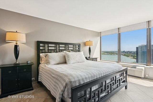 505 N Lake Shore Dr Unit 4807, Chicago, IL 60611 - tiled bedroom featuring a wall mounted air conditioner