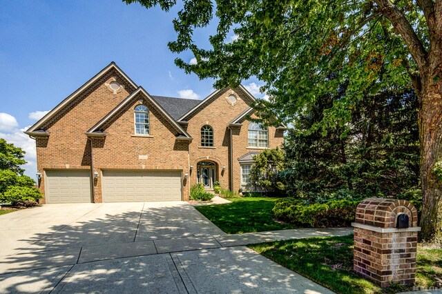22802 Eider Ct, Plainfield, IL 60585 - traditional home with an attached garage, driveway, and brick siding
