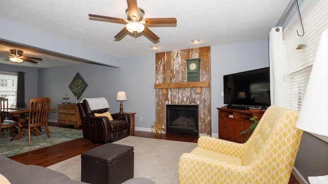 302 Gambel Ct, Normal, IL 61761 - living area featuring ceiling fan, wood finished floors, a fireplace, and baseboards