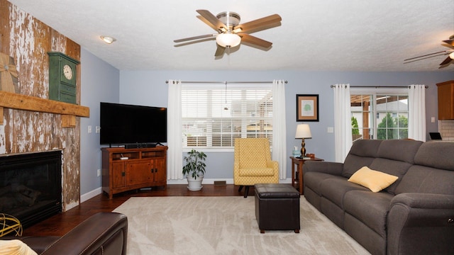 302 Gambel Ct, Normal, IL 61761 - living area with ceiling fan, wood finished floors, a high end fireplace, and baseboards