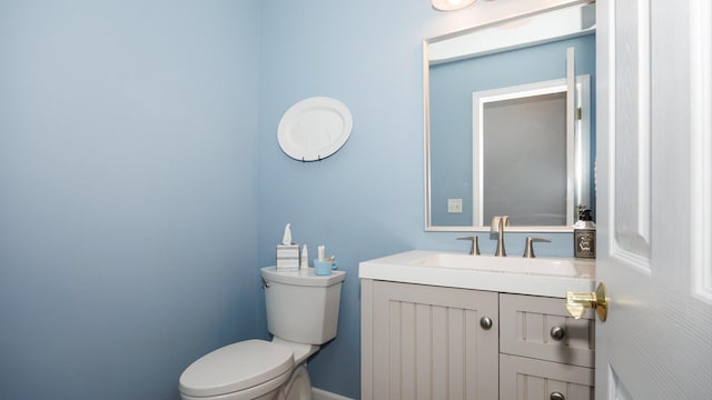 302 Gambel Ct, Normal, IL 61761 - bathroom with toilet, vanity, and baseboards