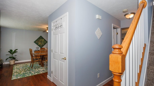 302 Gambel Ct, Normal, IL 61761 - corridor with a textured ceiling, dark wood finished floors, baseboards, and stairs