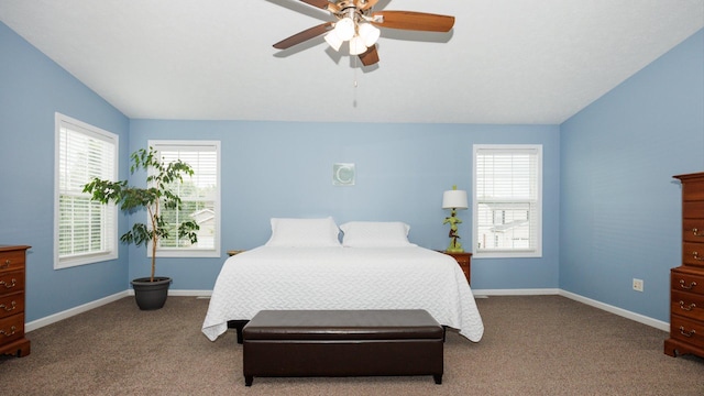 302 Gambel Ct, Normal, IL 61761 - carpeted bedroom with multiple windows, vaulted ceiling, baseboards, and ceiling fan
