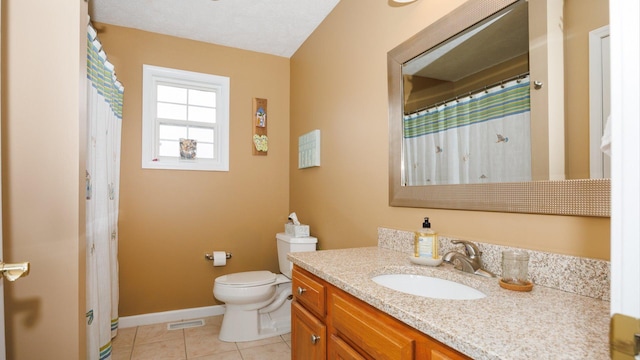 302 Gambel Ct, Normal, IL 61761 - bathroom with vanity, toilet, tile patterned floors, and baseboards