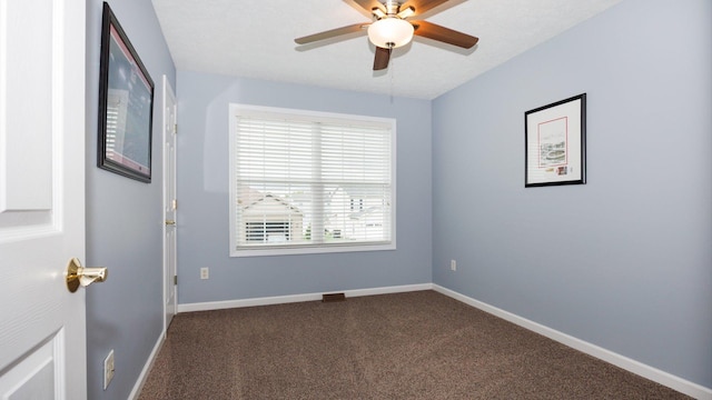 302 Gambel Ct, Normal, IL 61761 - unfurnished room featuring dark colored carpet, ceiling fan, and baseboards