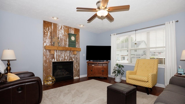 302 Gambel Ct, Normal, IL 61761 - living room with a premium fireplace, ceiling fan, wood finished floors, and baseboards