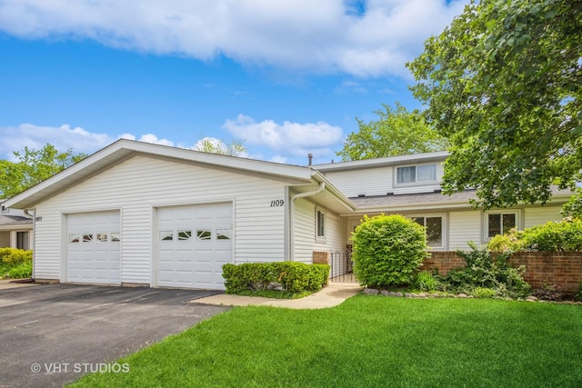 1109 Danvers Ct, Schaumburg, IL 60193 - view of front of property featuring a front yard, brick siding, and driveway