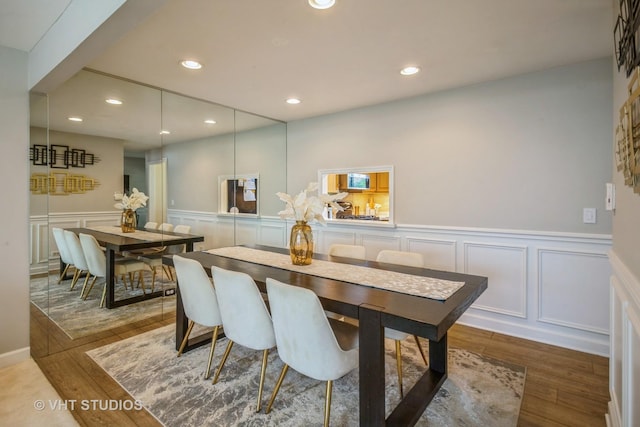 1109 Danvers Ct, Schaumburg, IL 60193 - dining area with a decorative wall, recessed lighting, a wainscoted wall, and wood finished floors