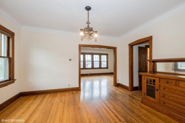 435 Jackson Blvd, Forest Park, IL 60130 - empty room with a chandelier, crown molding, baseboards, and light wood-style flooring