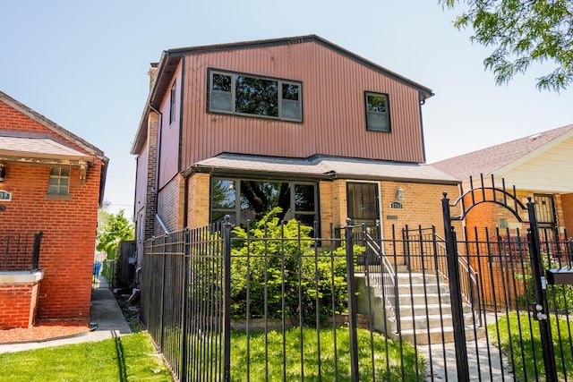 8743 S Constance Ave, Chicago, IL 60617 - view of front of property featuring a fenced front yard, a gate, and brick siding