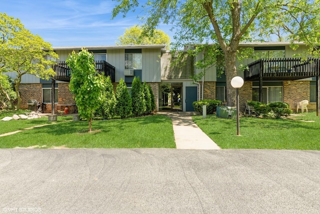 942 E Old Willow Rd Unit 101, Prospect Heights, IL 60070 - view of front of home featuring brick siding and a front lawn