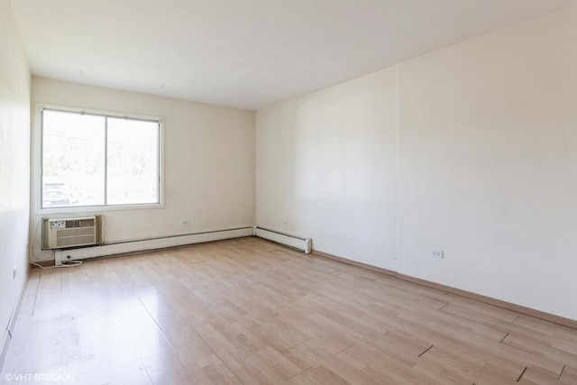 942 E Old Willow Rd Unit 101, Prospect Heights, IL 60070 - spare room featuring a wall mounted air conditioner, light wood-style flooring, and baseboards