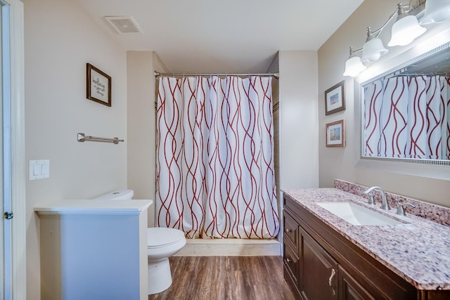 1163 Whispering Hills Dr, Naperville, IL 60540 - bathroom featuring toilet, vanity, and wood finished floors