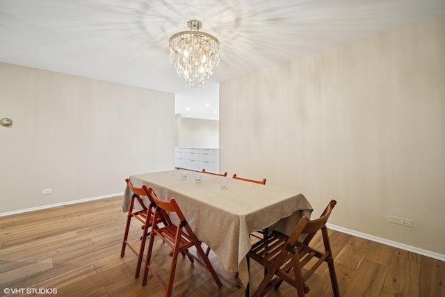 407 Ashland Ave Unit 6H, River Forest, IL 60305 - dining area featuring wood finished floors, baseboards, and a chandelier