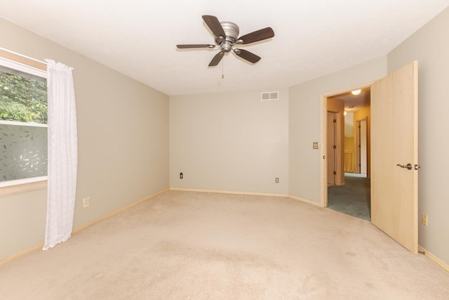 2321 Woodhavens Dr, Bloomington, IL 61701 - spare room with carpet flooring and ceiling fan
