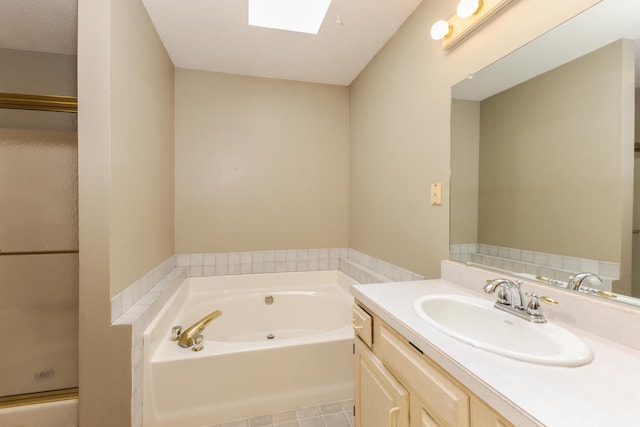 2321 Woodhavens Dr, Bloomington, IL 61701 - bathroom featuring vanity, a garden tub, a skylight, and a stall shower