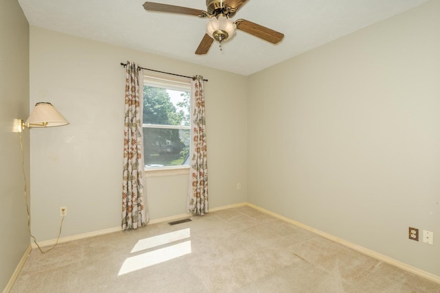 2321 Woodhavens Dr, Bloomington, IL 61701 - empty room featuring light carpet and a ceiling fan