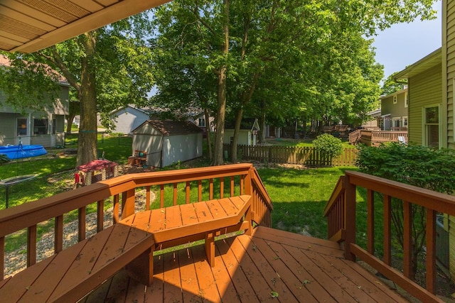 2321 Woodhavens Dr, Bloomington, IL 61701 - deck with a fenced backyard and a storage shed