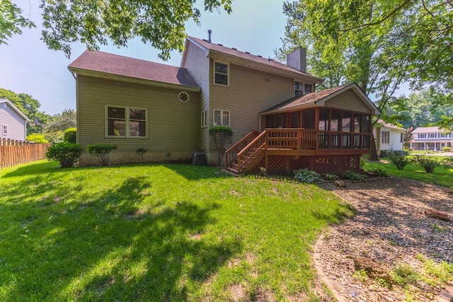 2321 Woodhavens Dr, Bloomington, IL 61701 - rear view of property with a sunroom, a chimney, and stairs