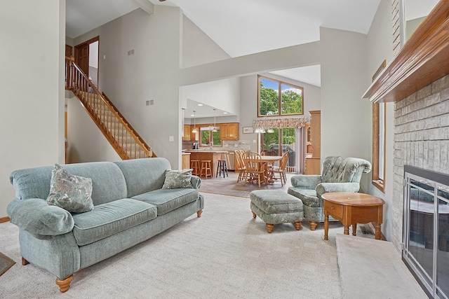 16212 Forest Ave, Oak Forest, IL 60452 - living room with high vaulted ceiling, a brick fireplace, and stairway