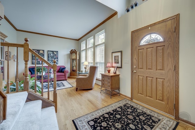 2693 Barrington Dr, Aurora, IL 60503 - entryway featuring ornamental molding, stairway, wood finished floors, and baseboards