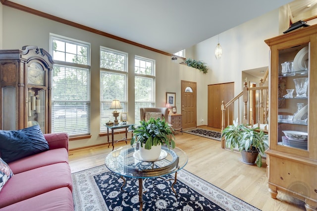 2693 Barrington Dr, Aurora, IL 60503 - living room with ornamental molding, light wood-style flooring, stairs, baseboards, and a high ceiling