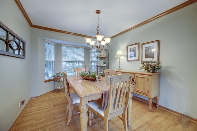 2693 Barrington Dr, Aurora, IL 60503 - dining room with a chandelier, ornamental molding, light wood-type flooring, and baseboards