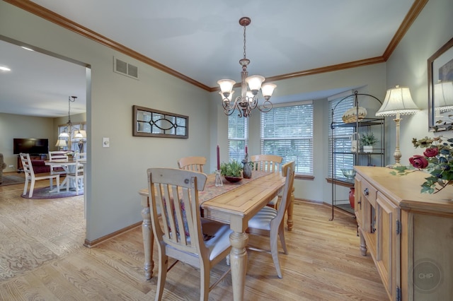 2693 Barrington Dr, Aurora, IL 60503 - dining room featuring a chandelier, light wood-type flooring, baseboards, and crown molding