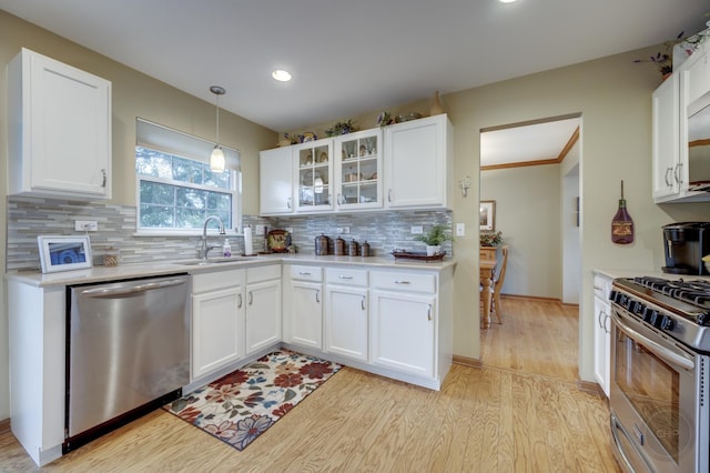 2693 Barrington Dr, Aurora, IL 60503 - kitchen featuring stainless steel appliances, a sink, light wood-style floors, light countertops, and recessed lighting
