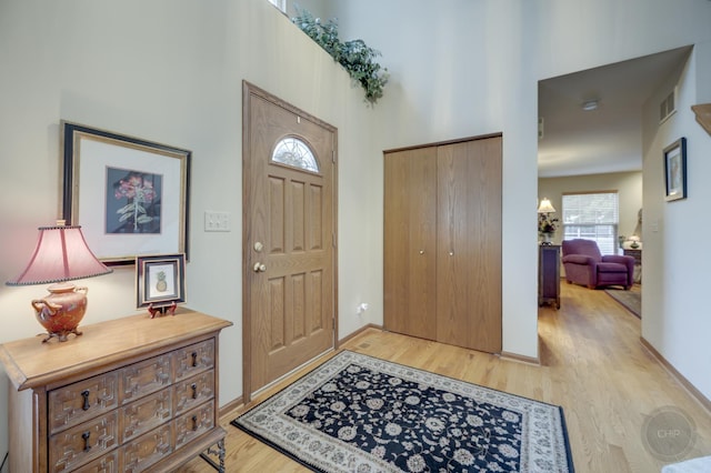 2693 Barrington Dr, Aurora, IL 60503 - foyer with light wood-type flooring, a high ceiling, and baseboards