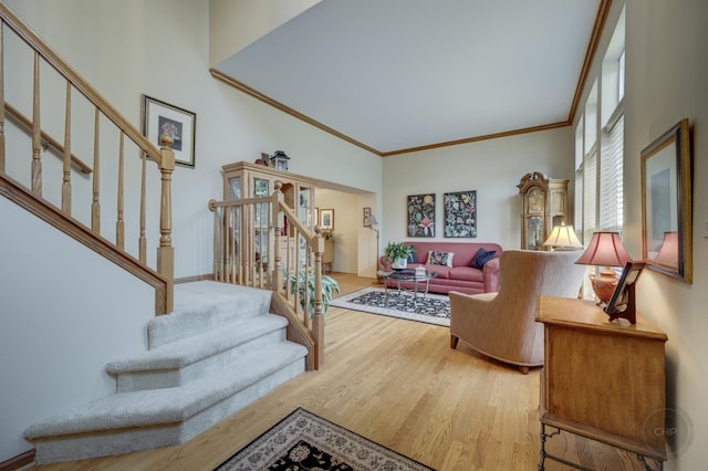 2693 Barrington Dr, Aurora, IL 60503 - living area with wood finished floors, stairs, and crown molding