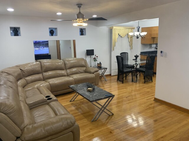 9323 S Normal Ave, Chicago, IL 60620 - living area with a chandelier, light wood-style flooring, a ceiling fan, baseboards, and recessed lighting