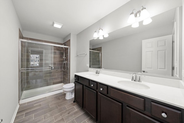 1413 N Charles Ave, Naperville, IL 60563 - full bathroom featuring double vanity, toilet, a shower stall, and wood finish floors