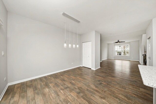 1413 N Charles Ave, Naperville, IL 60563 - unfurnished living room featuring dark wood-type flooring and baseboards