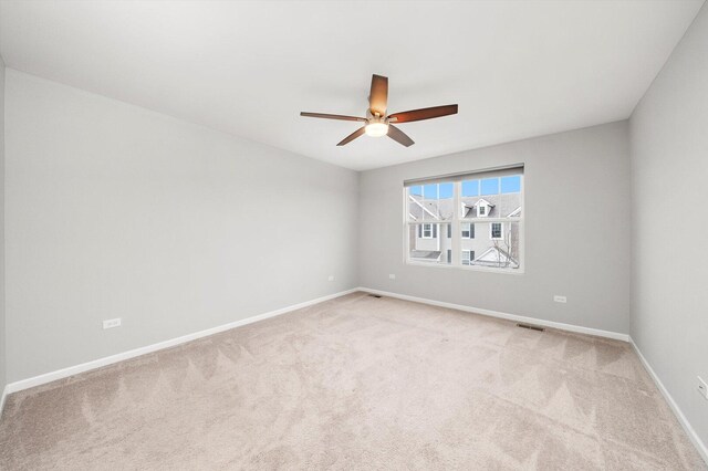 1413 N Charles Ave, Naperville, IL 60563 - empty room featuring ceiling fan, light colored carpet, and baseboards