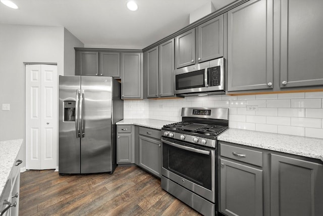 1413 N Charles Ave, Naperville, IL 60563 - kitchen featuring appliances with stainless steel finishes, dark wood-style floors, gray cabinets, decorative backsplash, and recessed lighting