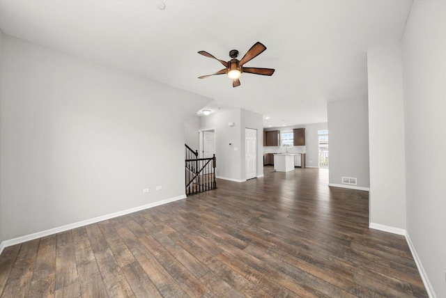 1413 N Charles Ave, Naperville, IL 60563 - unfurnished living room with a ceiling fan, dark wood-type flooring, and baseboards