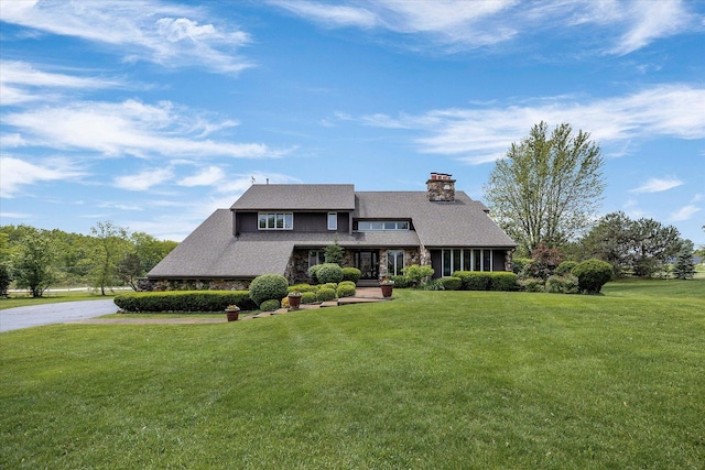 7 Surrey Rd, Lemont, IL 60439 - view of front of property with a front yard, a chimney, and stone siding