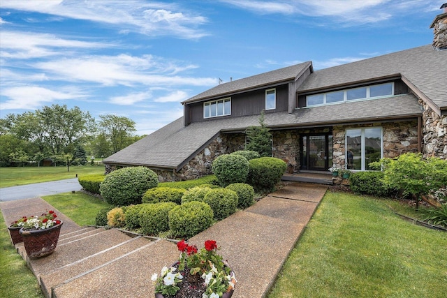 7 Surrey Rd, Lemont, IL 60439 - view of front of property with stone siding, a front yard, and roof with shingles