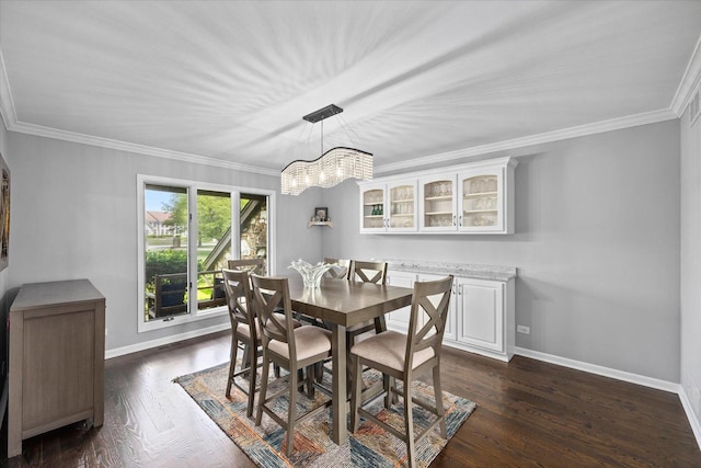7 Surrey Rd, Lemont, IL 60439 - dining area with crown molding, baseboards, dark wood-style flooring, and a chandelier