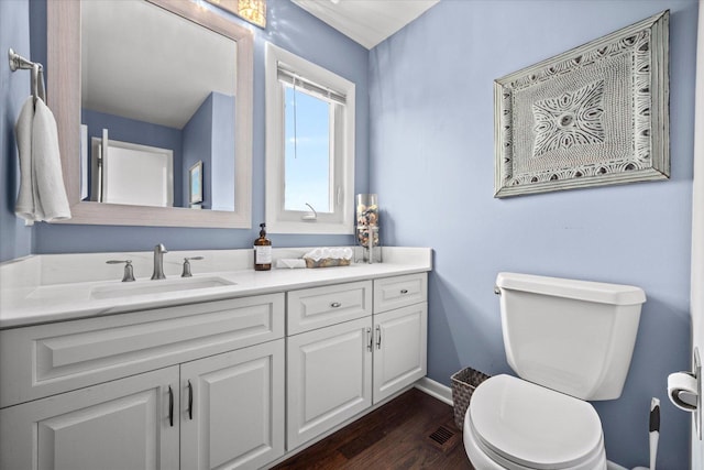 7 Surrey Rd, Lemont, IL 60439 - half bath with vanity, baseboards, toilet, and wood finished floors