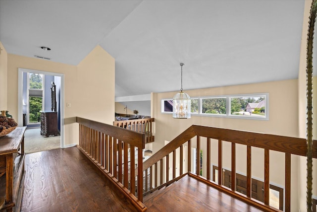 7 Surrey Rd, Lemont, IL 60439 - corridor featuring an upstairs landing, a chandelier, healthy amount of natural light, wood finished floors, and vaulted ceiling