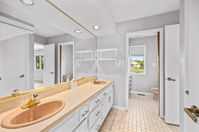 7 Surrey Rd, Lemont, IL 60439 - bathroom with toilet, double vanity, healthy amount of natural light, baseboards, and recessed lighting