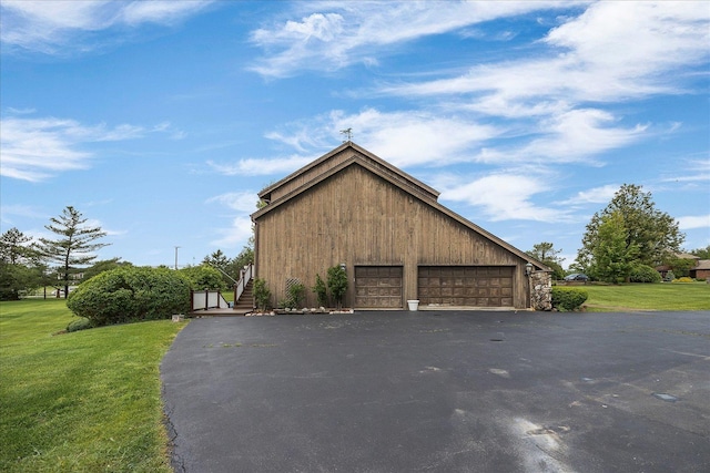 7 Surrey Rd, Lemont, IL 60439 - view of side of home featuring a garage, a yard, and stairway