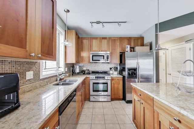 3159 W Washington Blvd, Chicago, IL 60612 - kitchen featuring stainless steel appliances, a sink, light stone countertops, and backsplash