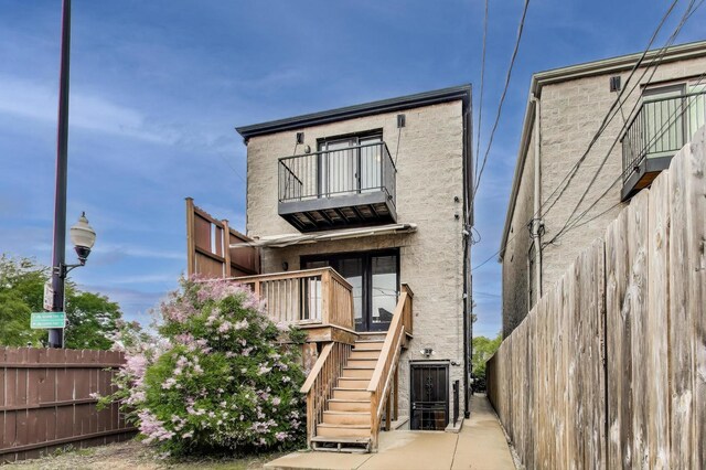 3159 W Washington Blvd, Chicago, IL 60612 - rear view of property with a balcony and stairs
