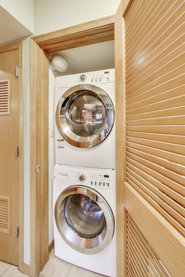 3159 W Washington Blvd, Chicago, IL 60612 - washroom featuring stacked washing machine and dryer and light tile patterned floors