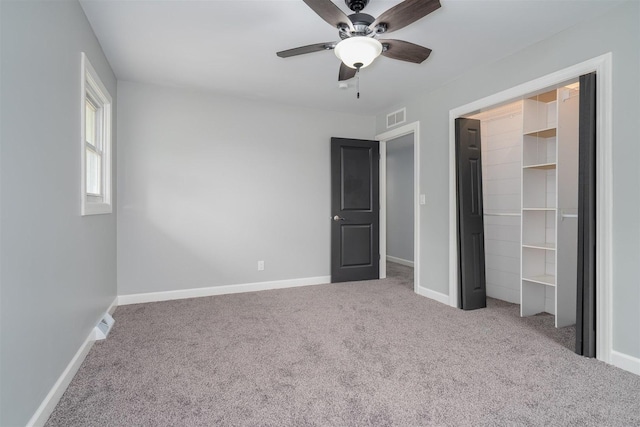 817 N Mohave Dr, Pontiac, IL 61764 - unfurnished bedroom featuring carpet, baseboards, a closet, and ceiling fan